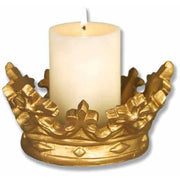 Candle set in an ornate, old world European crown-shaped holder with classical fleur-de-lis and Baroque detailing.