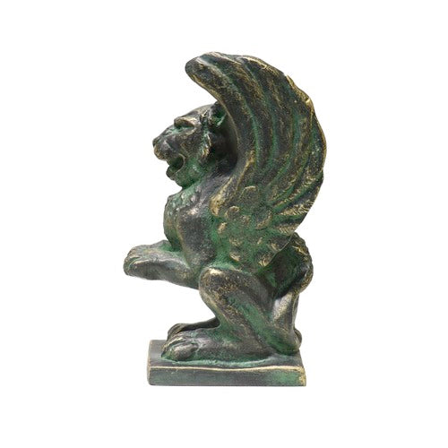 Winged griffin statue in a classical old world European style with ornate detailing and a strong, mythical medieval theme. Side View