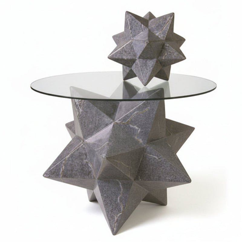 Star-shaped geometric table base with glass top, featuring ornate, old world European and classical design elements.