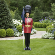 British royal guard statue in ornate old world European style uniform, tall bearskin hat, holding a flag, classical military theme Side Angle