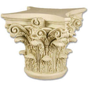 Corinthian column capital with ornate acanthus leaves and classical scrollwork in old world European architectural style.