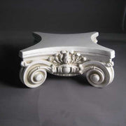 Ornate classical corner capital with intricate Baroque scrollwork and acanthus leaf detailing in old world European style. Side Angle View