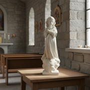 Child angel statue in classical old world European style, standing on clouds with folded arms and serene expression. Side Angle