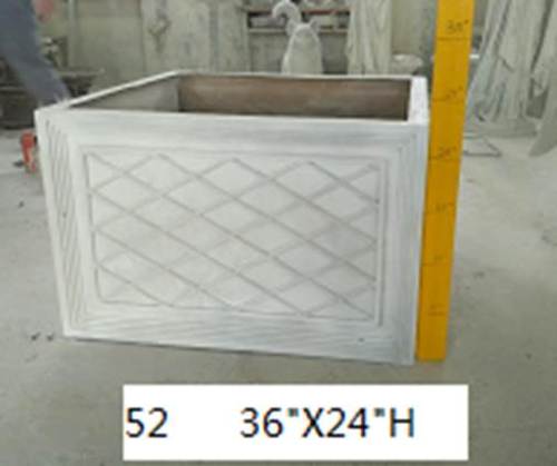 Square planter with classical old world European lattice panel design and ornate carved border detailing on all sides. Side Angle