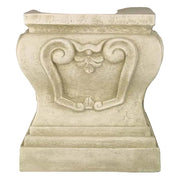 Ornate pedestal base with classical old world European scrollwork and leaf motif, featuring a symmetrical, architectural design.