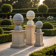 Ornate old world European finials with classical rounded tops and fluted bases, displayed in three graduated sizes on square pedestals. Side Angle