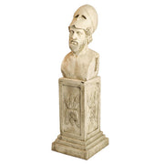 Classical Greek bust of a bearded warrior in a helmet on an ornate pedestal with carved acanthus leaf details. Side View
