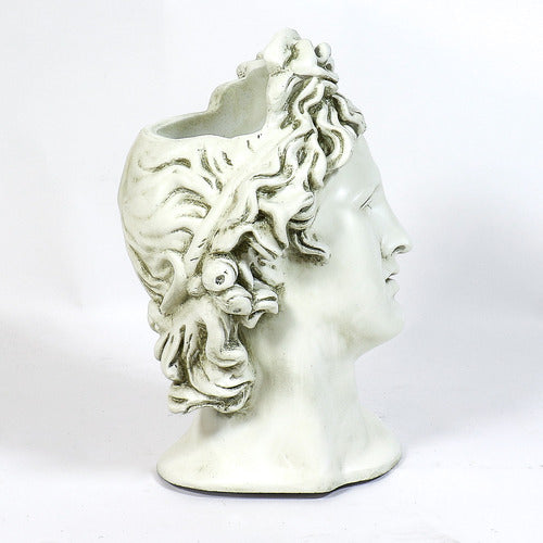 Classical Greek-style bust with ornate, wavy hair and serene expression, inspired by Renaissance and old world European sculpture. Side Angle View