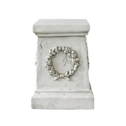 Square pedestal with ornate classical wreath relief, featuring old world European and Baroque-inspired architectural detailing. Side Angle