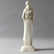 Saintly monk statue in old world European style, holding a bird with an ornate, classical design and a crane at his feet. Different Angle