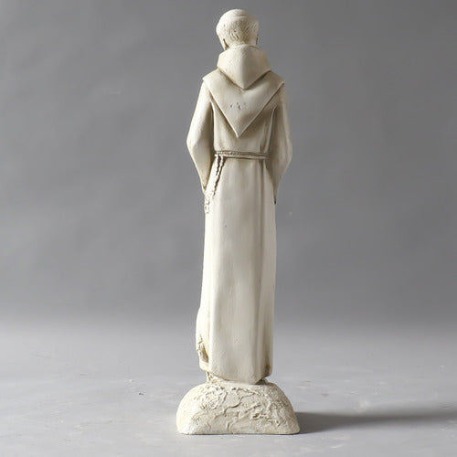 Saintly monk statue in old world European style, holding a bird with an ornate, classical design and a crane at his feet. Different Angle