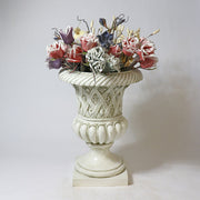 Ornate classical urn with intricate lattice and floral Baroque detailing, fluted base, and old world European design elements Side Angle