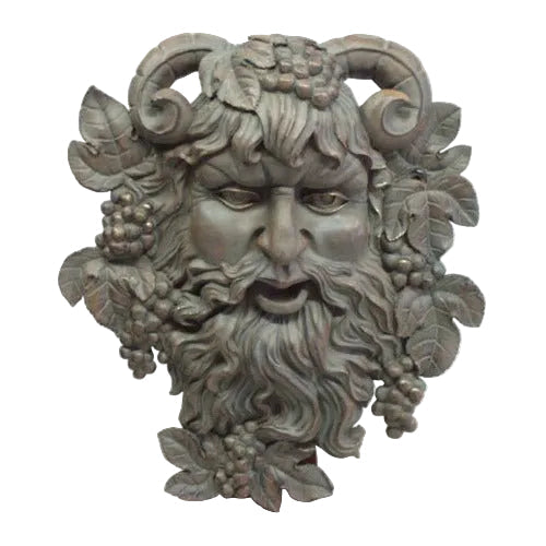 Grotesque bearded face with ram horns, grape clusters, and ornate leaves in an old world European classical style. Side View