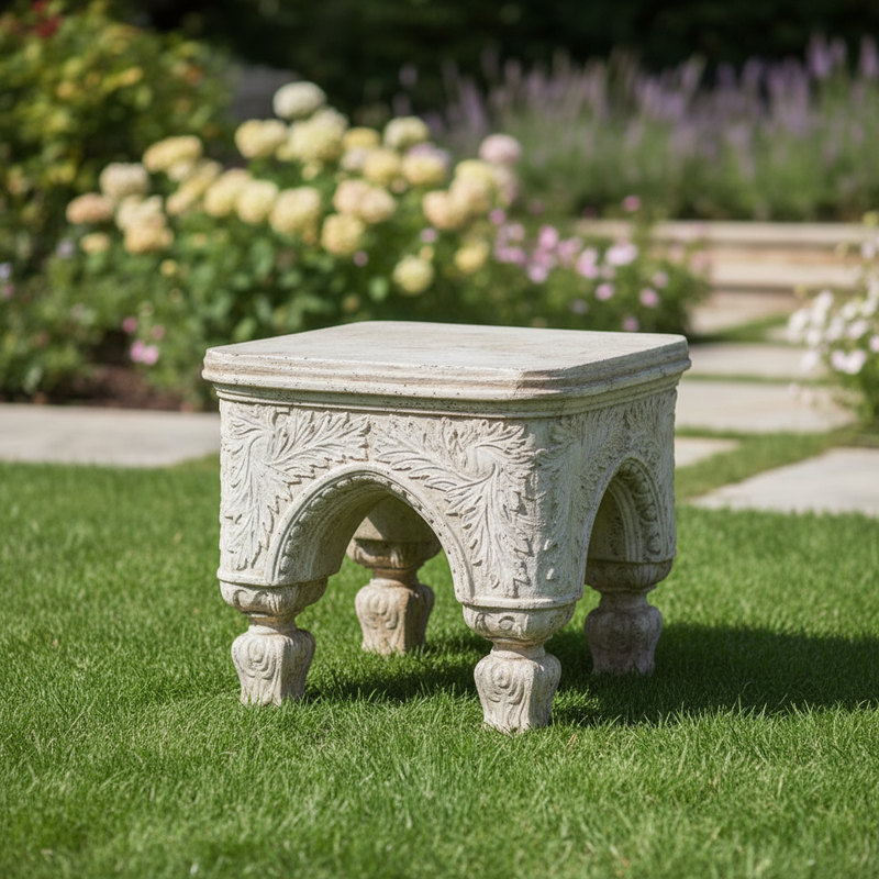 Ornate old world European stool with classical arches, intricate Baroque carvings, and four sculpted legs in a medieval style. Side Angle