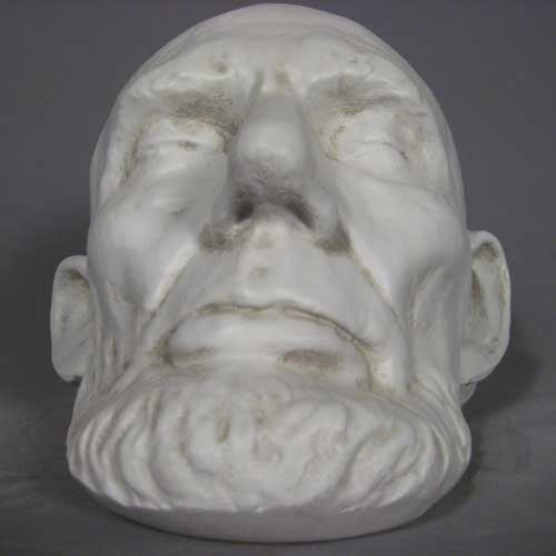 Classical old world European sculpted head with closed eyes, detailed facial features, and a prominent beard in Renaissance style. Other Angle