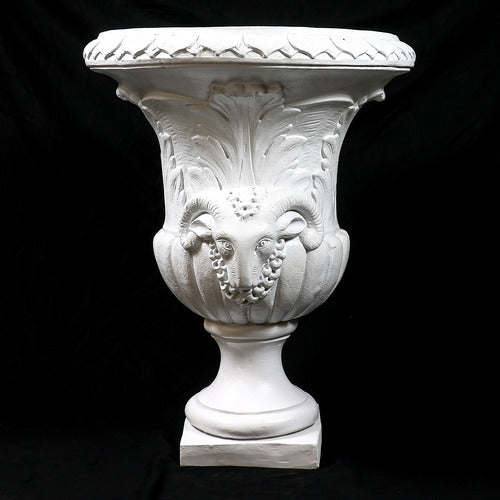 Ornate classical urn with Baroque detailing, acanthus leaf motifs, and ram head accents on a pedestal base. Other Angle