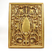 Ornate rectangular plaque with intricate Baroque scrollwork and classical old world European detailing in raised relief. Other Angle