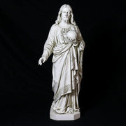 Jesus statue in classical Renaissance style, featuring ornate drapery and detailed facial features, holding a globe in one hand. Different Angle