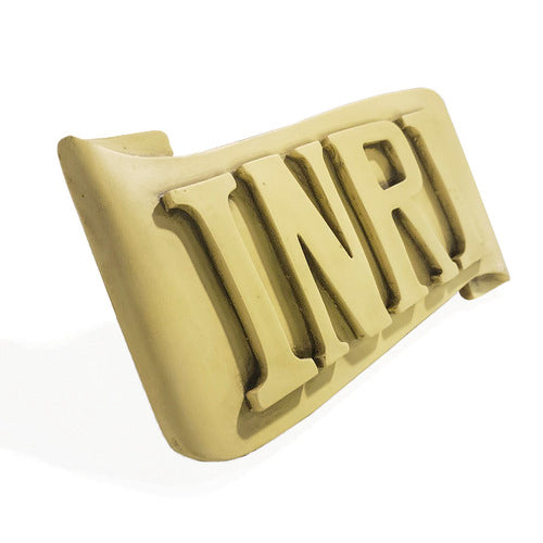 INRI plaque with bold, classical raised lettering on an ornate, scroll-shaped background in old world European style. Different Angle
