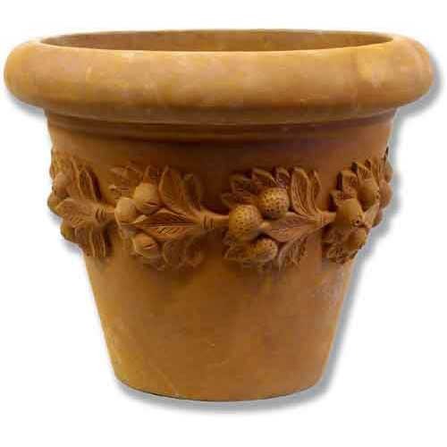 Ornate old world European planter with classical relief of fruit and foliage garlands encircling the upper section.
