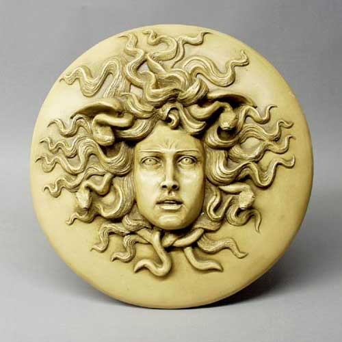Medusa head relief with intricate serpentine hair, classical Greek style, ornate detailing, and dramatic facial expression. Side View