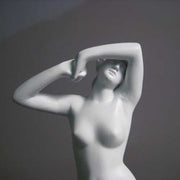 Classical female torso sculpture with raised arms, inspired by Renaissance and Greek art, featuring smooth, elegant contours. Side View