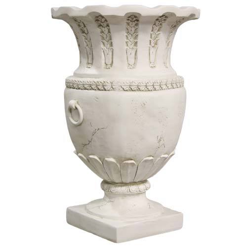 Ornate classical urn with fluted rim, laurel leaf detailing, and ring handles in an old world European style. Side View