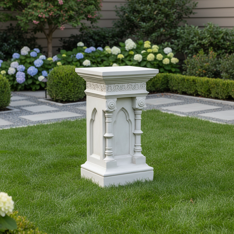 Ornate pedestal with classical Gothic arches, fluted columns, and intricate old world European detailing on the upper border. Side Angle