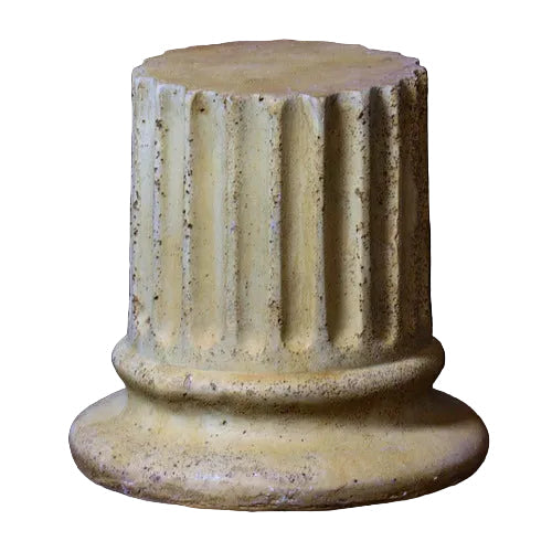 Fluted column base with classical Greek architectural style and ornate, weathered detailing. Side View