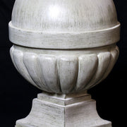 Ornate old world European finials with classical rounded tops and fluted bases, displayed in three graduated sizes on square pedestals. Other Angle