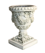 Ornate Baroque urn planter with cherub reliefs, classical garlands, and intricate old world European detailing on a square pedestal base Side View