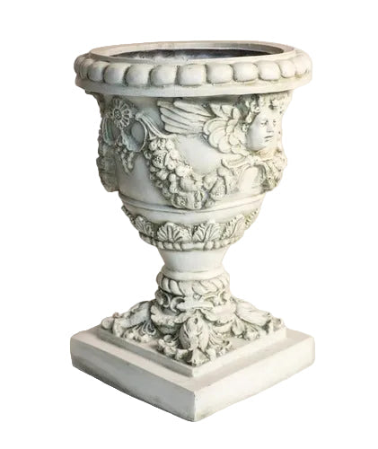 Ornate Baroque urn planter with cherub reliefs, classical garlands, and intricate old world European detailing on a square pedestal base Side View