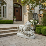 Lion sculpture in classical Baroque style, depicted mid-roar with detailed mane, standing over a subdued animal on an ornate base. Side Angle