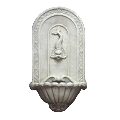 Wall fountain with ornate old world European design, arched backplate, and classical dolphin spout in relief above scalloped basin.
