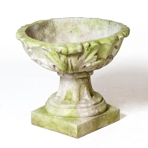 Ornate old world European urn with scalloped rim and classical pedestal base, featuring weathered Baroque detailing.