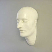Classical European sculpted head with closed eyes, smooth features, and serene expression, evoking Renaissance and old world style. Different Angle