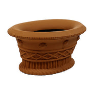 Ornate planter with classical old world European detailing, featuring shell motifs, lattice patterns, and a fluted base.