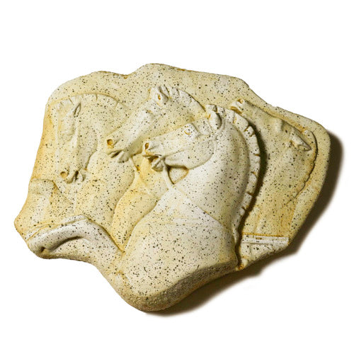 Relief sculpture featuring three horses in a classical, old world European style with ornate, Renaissance-inspired detailing. Side View