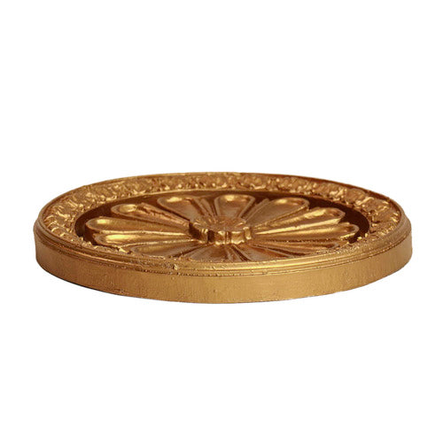 Ornate round medallion with classical Baroque floral motif and detailed raised border in old world European style. Side Angle