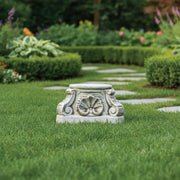 Ornate pedestal base with classical scrollwork, shell motif, and old world European architectural detailing in a Baroque style. Side Angle