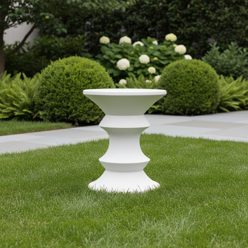 Ornate classical pedestal with symmetrical, tiered design and old world European architectural influence. Side Angle
