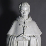Saint statue in classical old world European style, featuring ornate robes and a rosary, standing in a reverent pose. Different Angle