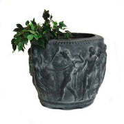 Ornate planter with classical Greek relief of dancing figures and intricate old world European detailing, leafy plant inside.