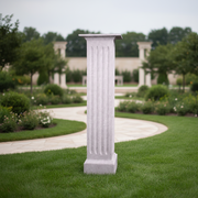Classical Greek fluted column pedestal with square base and ornate capital, featuring old world European architectural style. Side Angle