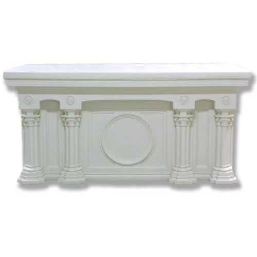 Classical altar table with ornate fluted columns, round medallions, and Renaissance-inspired architectural detailing.