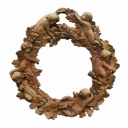 Ornate Baroque wreath with cherubs and intricate leaf detailing in an old world European style. Side View