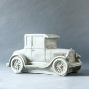 Vintage car sculpture with old world European charm, featuring ornate classical detailing and a nostalgic, early 20th-century design. Different Angle