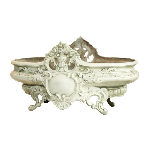 Ornate Baroque planter with intricate scrollwork, floral motifs, and classical old world European detailing on curved legs. Side View