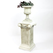 Ornate classical urn planter with fluted detailing atop a Greek-inspired Ionic column pedestal, featuring old world European style. Side View