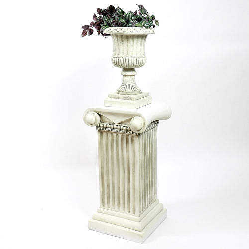 Ornate classical urn planter with fluted detailing atop a Greek-inspired Ionic column pedestal, featuring old world European style. Side View